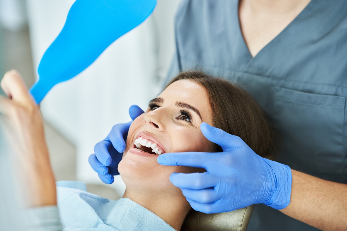 Patient reviewing smile results during cosmetic dental consultation in Houston